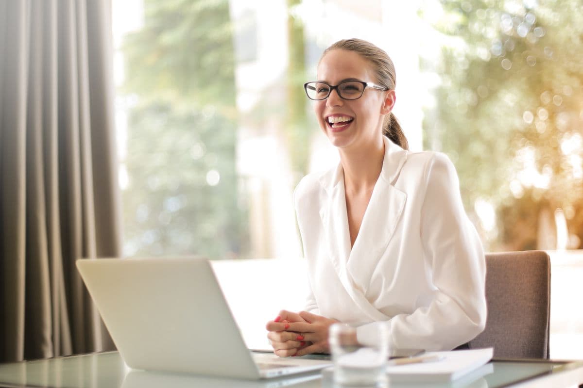 Professional smiling warmly in an office setting